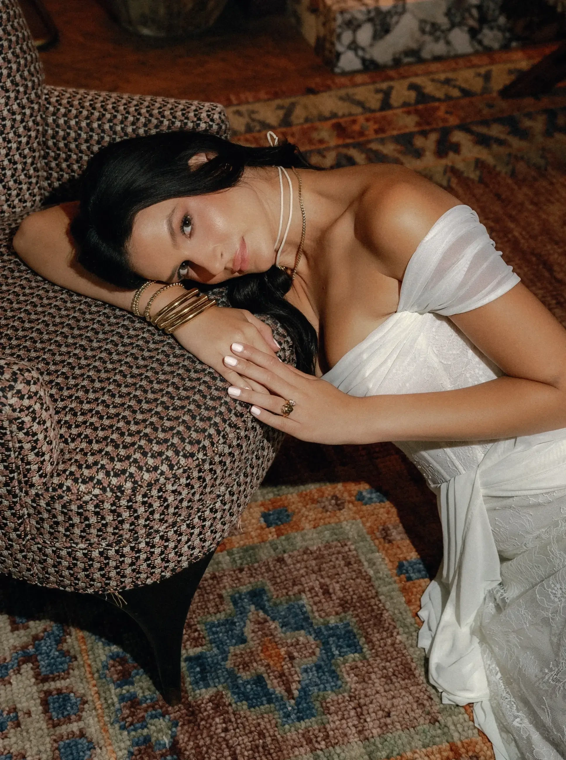 model is wearing an off the shoulder bridal gown