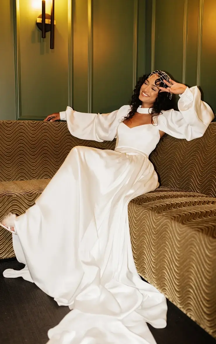 Model is wearing a vintage inspired basque waist a-line wedding dress