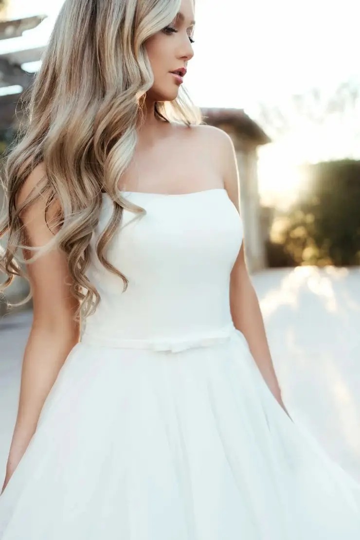 Romantic Ruffles: Soft and Feminine Wedding Dresses at Honest in Ivory