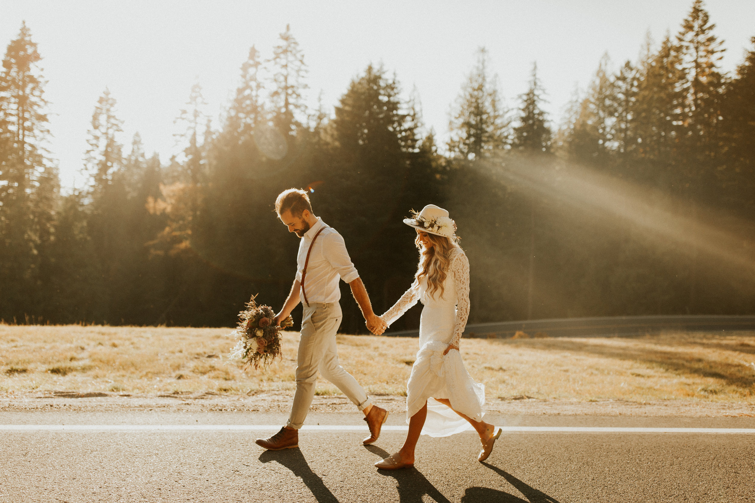 image of bride and groom leaving wedding photo shoot at mt spokane