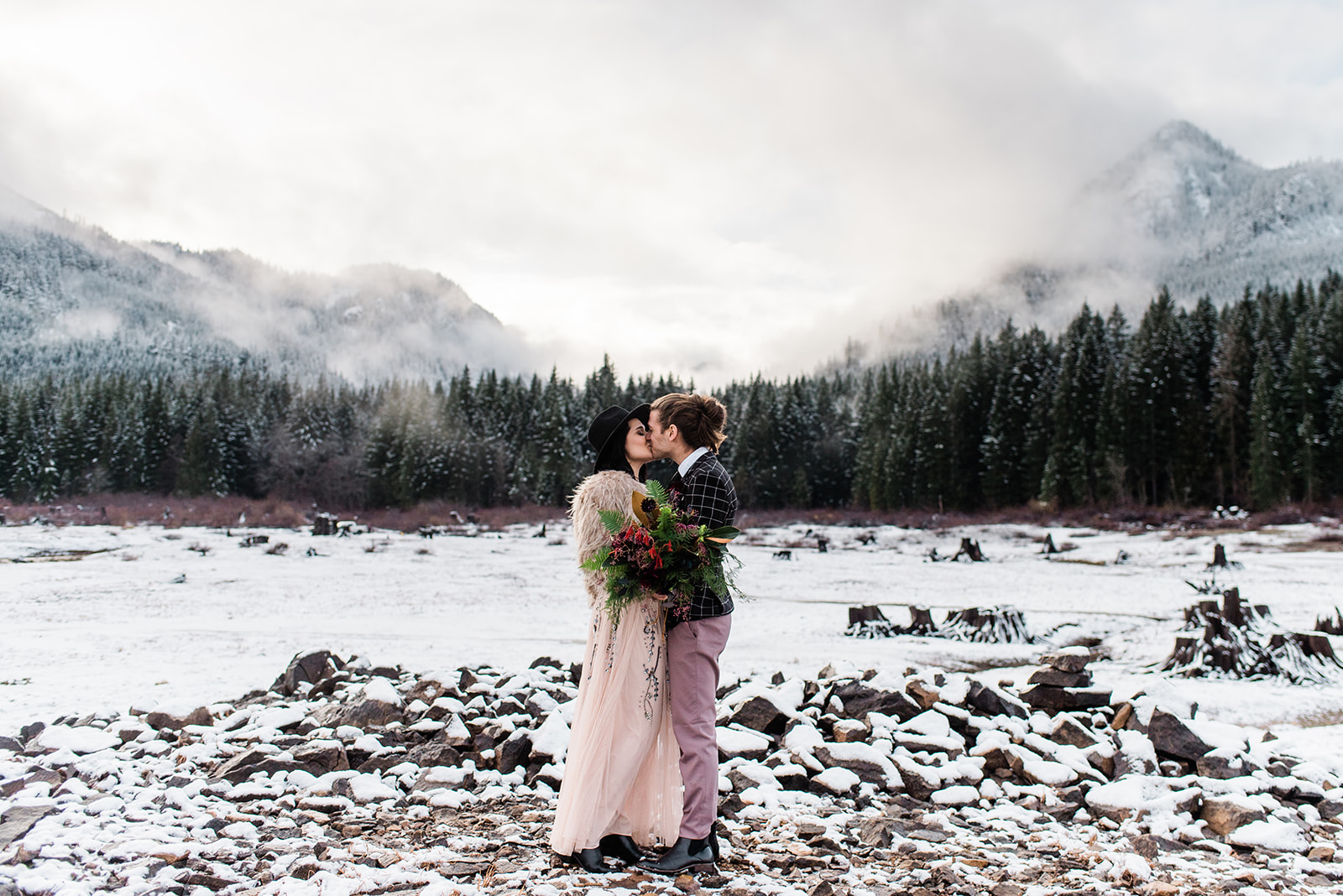 kiss winter bride and groom wedding spokane