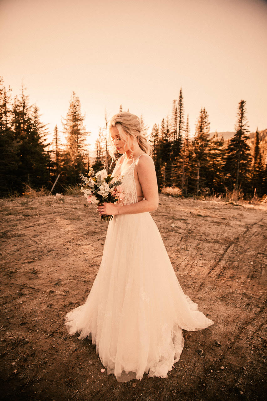 bride holding bouquet in wedding dress spokane