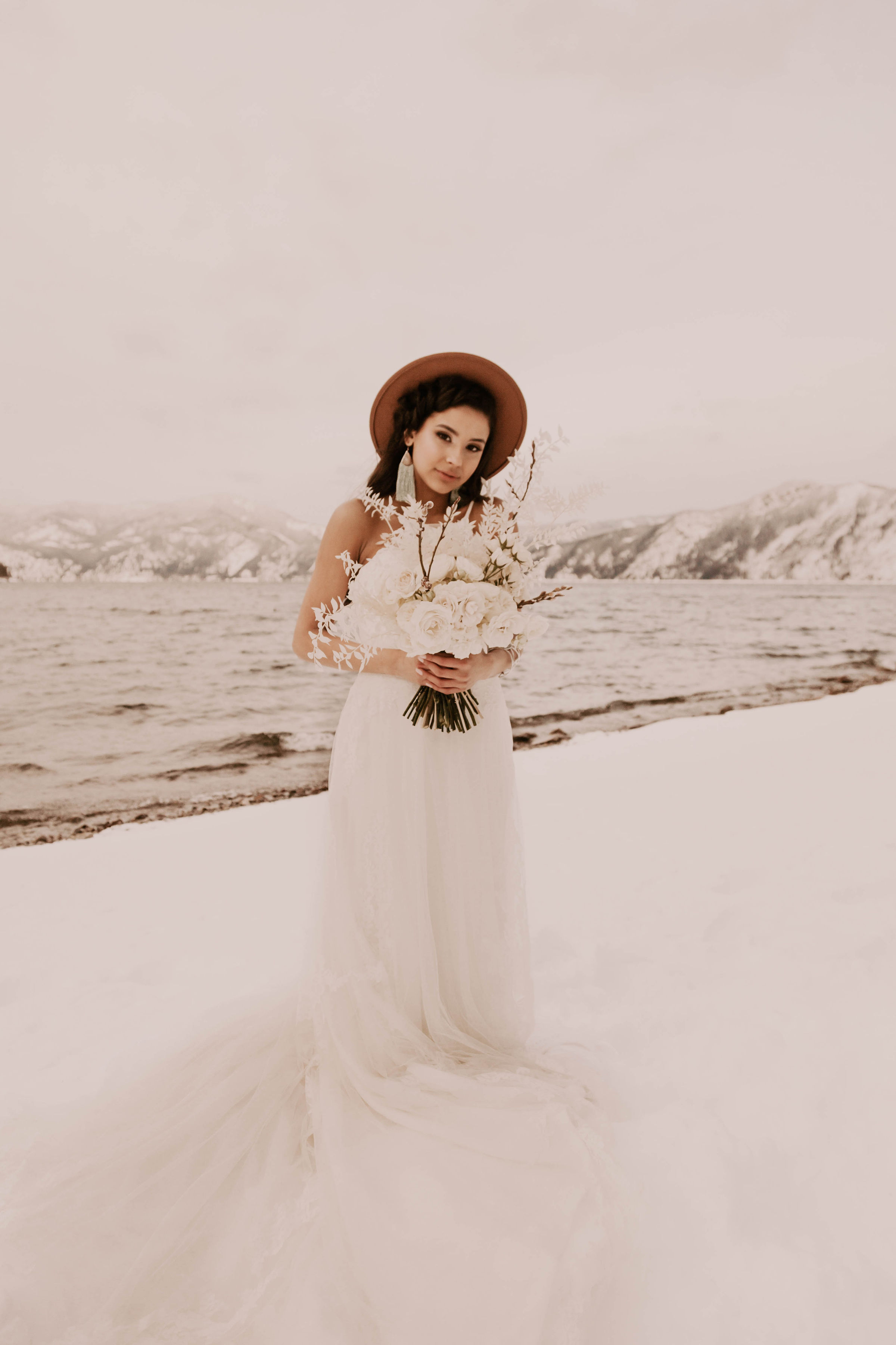 winter wedding bride spokane florals and brown hat