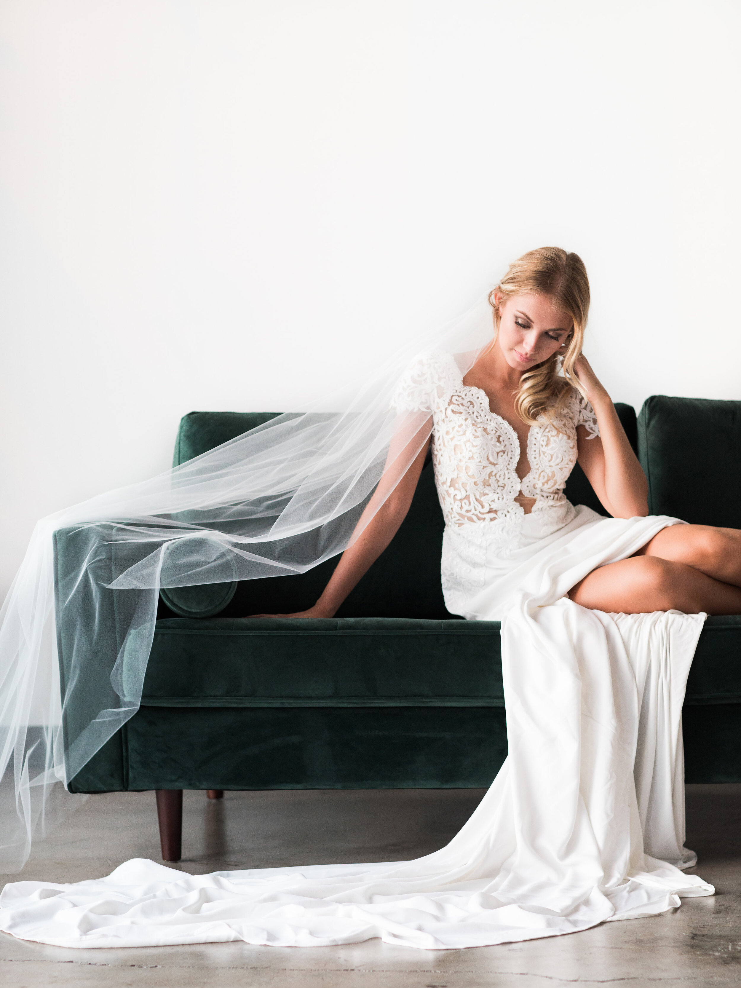 Spokane bride wedding dress model velvet couch honest in ivory veil